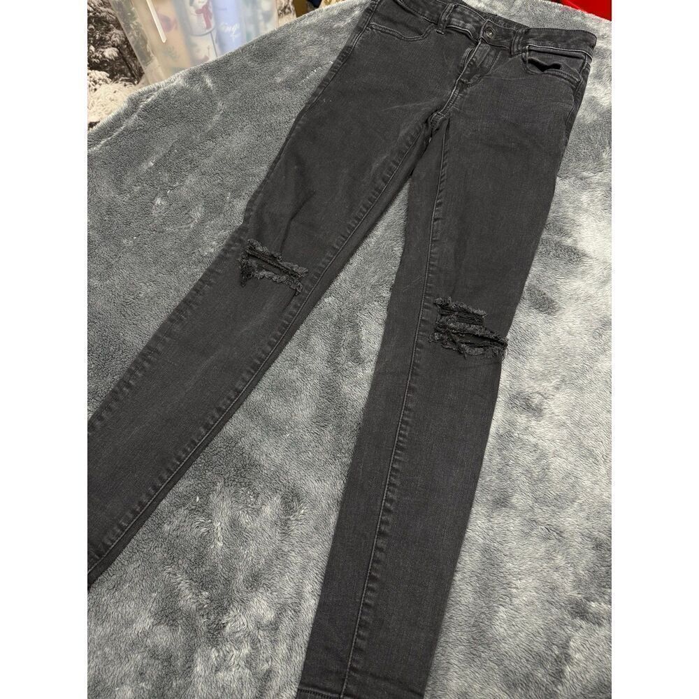 American Eagle Women’s Distressed Stretch Jeans, Size 2 and color is black.